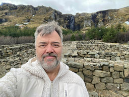 The beloved actor Örn Árnason is also a licensed guide with the right to drive a bus for 20 people. Here he is close to Ólafsvík, in and old round-up area.