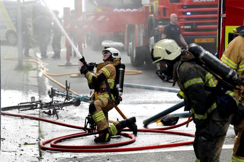 Fire fighters at work yesterday.