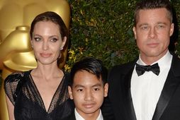 Angelina Jolie, Maddox Jolie-Pitt og Brad Pitt árið 2013.
