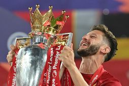 Adam Lallana varð Englandsmeistari með Liverpool.